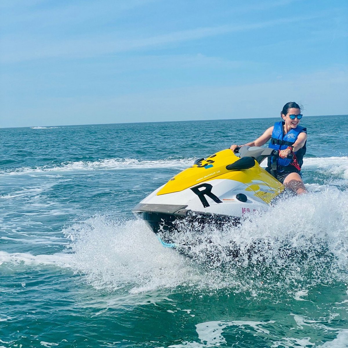 a person riding a surf board on a body of water